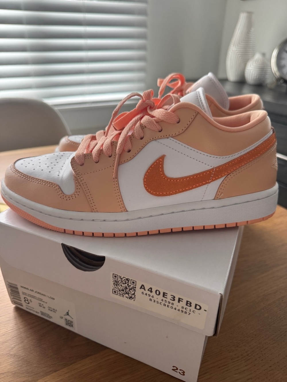 Nike Peach and White Low-Top Air Jordan 1 Low Sneakers with Orange Swoosh